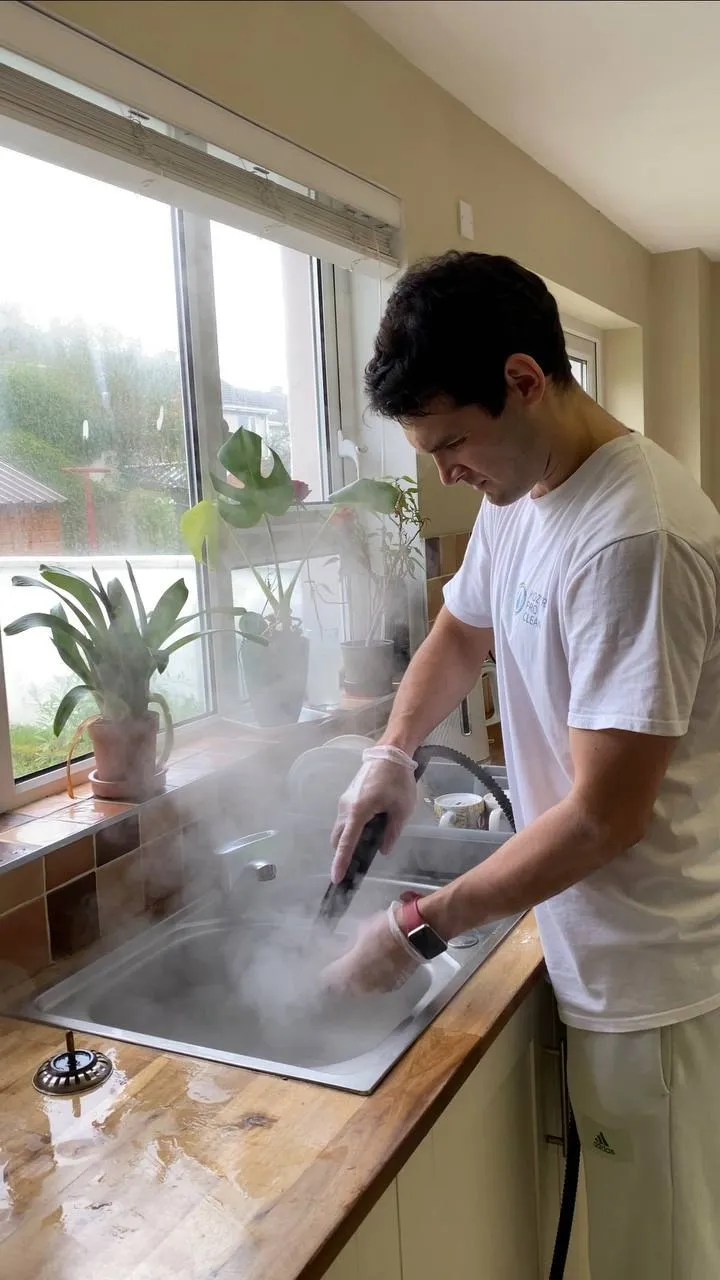 Steam cleaning a kitchen worktop